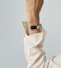Baume & Mercier model wearing watch. Tap to shop new watches image