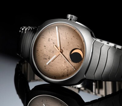 H.Moser & Cie Streamliner Perpetual Moon Concept Meteorite watch on mirrored background. Tap to shop all image
