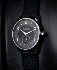 Louis Erard watch on black background. Tap to discover the brand. image