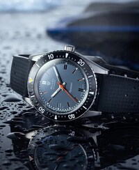 Image of Nivada Grenchen watch on water. Tap to shop the brand image