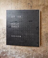Image of QLOCKTWO watch on wall. Tap to shop the brand image