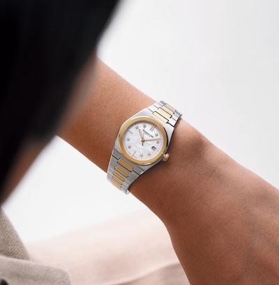 Image of ladies' hand wearing bi-colour watch image